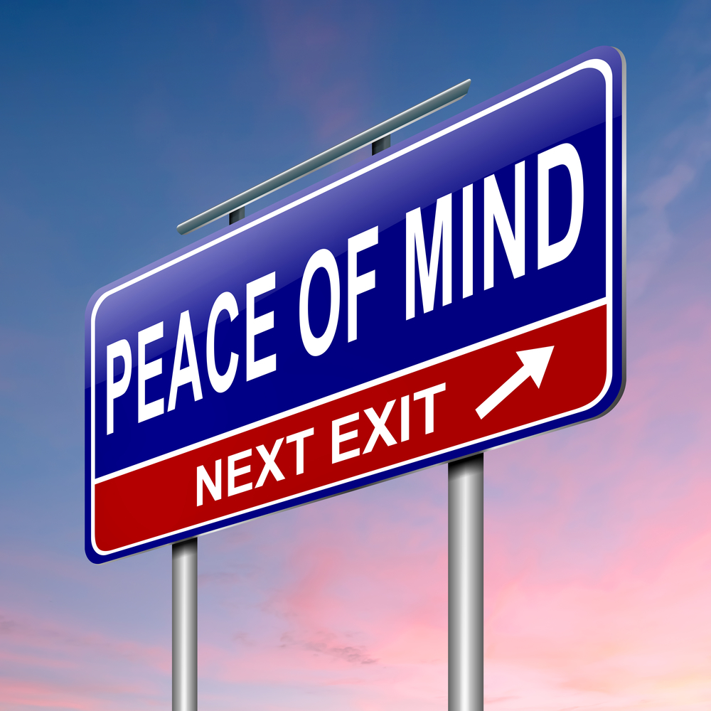 A blue and red road sign with the words Peace of Mind Next Exit