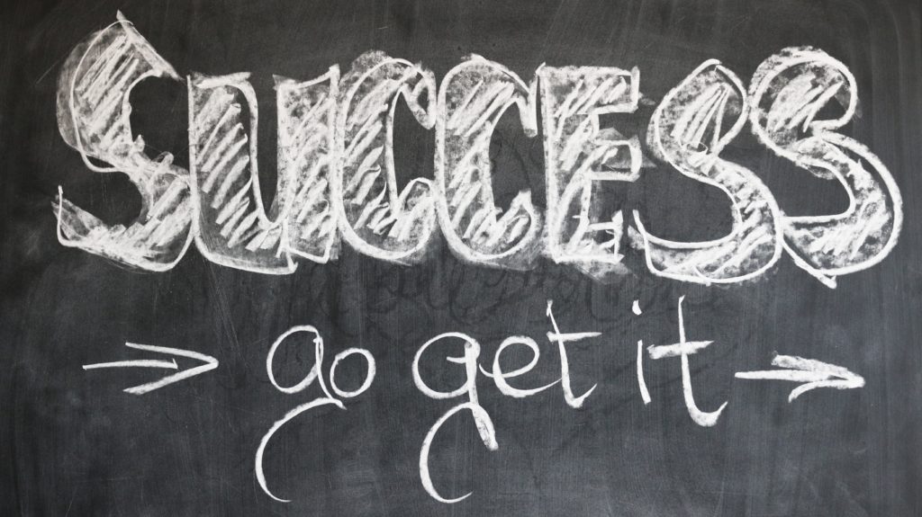 black board with the words success go get it 