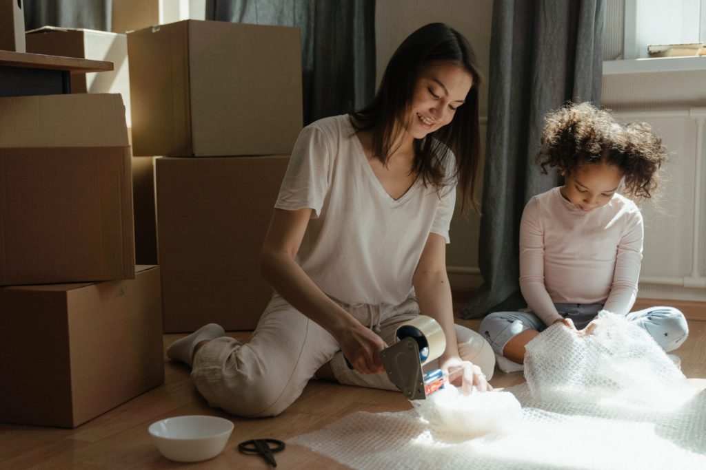 Mother and daughter decluttering their home.