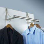 An over the bar with hangers holding shirts