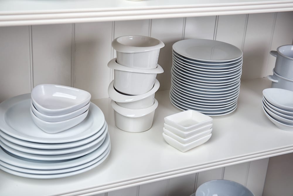 Beautifully stacked white dishes, plates,bowls, tea plates 
